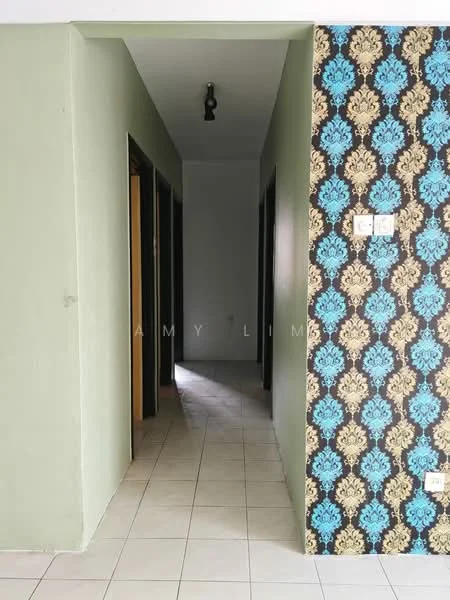 Hallway features: green painted walls, decorative wallpaper with blue and black pattern, tile flooring, ceiling light fixture, door frames, two doorways visible, natural light from end of hallway.