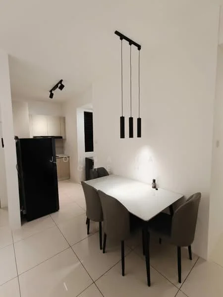 Dining features: white dining table, 4 upholstered dining chairs in grey, pendant lighting with three black fixtures, white painted walls, glossy tile flooring, built-in cabinetry, black fridge, recessed ceiling lights; style: modern. Kitchen features: built-in kitchen cabinets, black appliances, white countertop, open layout to dining area; style: modern.