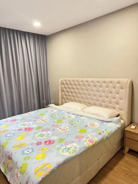 Bedroom features: king-size bed, upholstered headboard, bedding with floral pattern, wooden flooring, grey curtains, nightstand, table lamp; style: modern.