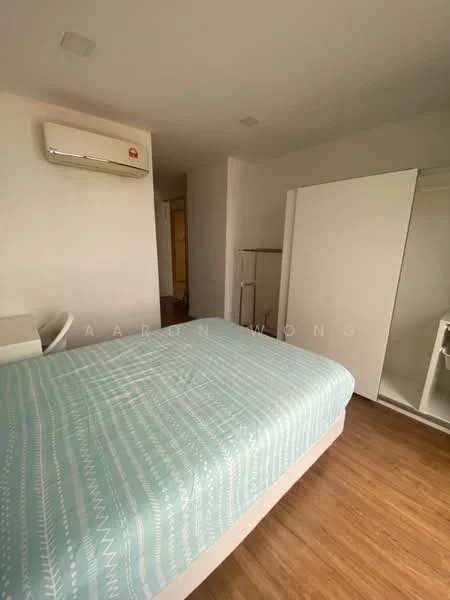 Bedroom features: queen-size bed with light blue patterned bedding, wooden flooring, 1 wall-mounted split AC, built-in wardrobe with sliding doors, white painted walls, desk and chair, natural light from doorway; style: modern.
