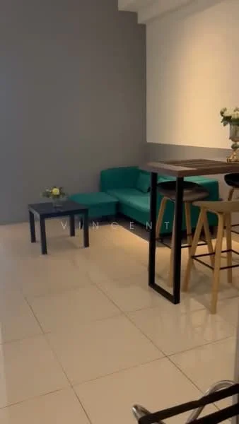 Living features: teal fabric sofa, black coffee table, wooden bar table, two wooden bar stools, white walls, grey accent wall, glossy tile flooring, decorative flower arrangement; style: modern.
