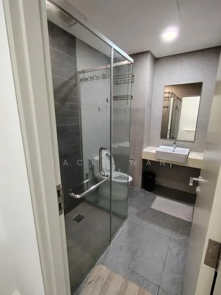 Bathroom features: glass shower enclosure, rain shower head, handheld shower, single-sink vanity with countertop, white basin, mirror above sink, toilet, grey tile flooring, grey wall tiles, towel rack, built-in shelving, recessed lighting; style: modern.