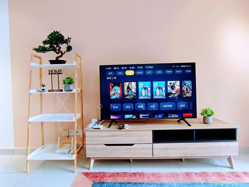 Living features: light pink painted walls, white tiled flooring, wooden TV console, wall-mounted TV, decorative plant on TV console, 2-tier white shelving unit, decorative plant on shelving unit, area rug with geometric pattern; style: modern.