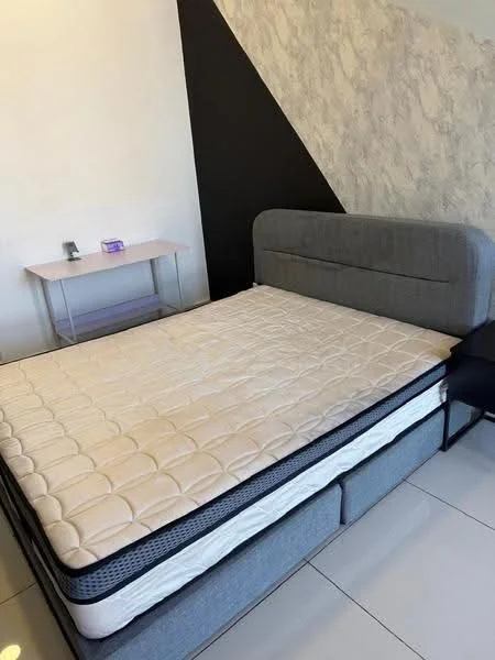 Bedroom features: queen-size bed, upholstered headboard, grey bed frame, nightstand, white bedside table, laminate flooring, plain white walls, black accent wall, table lamp, decorative wall texture; style: modern.