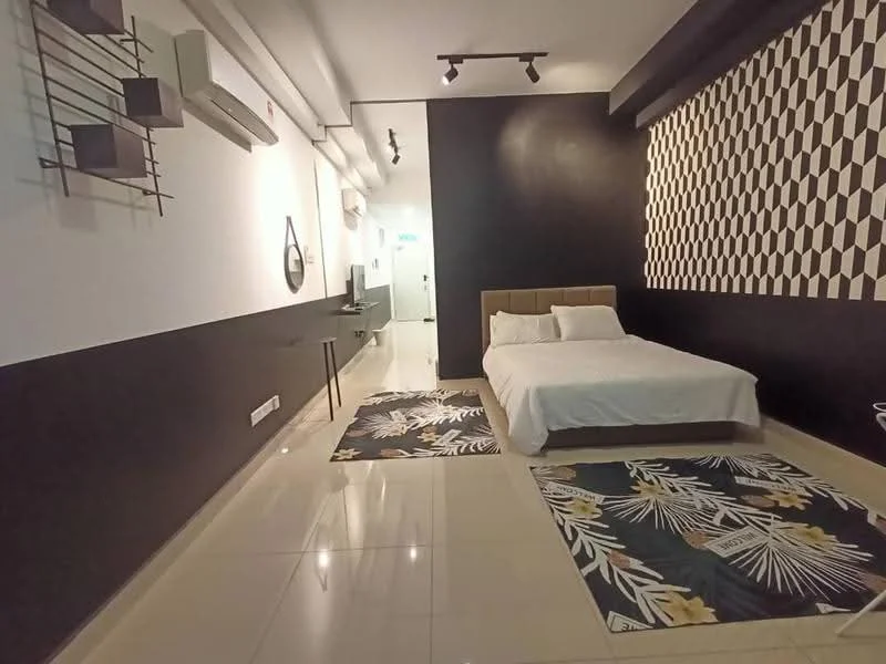 Bedroom features: king-size bed with upholstered headboard, white bedding, 2 area rugs with floral pattern, black accent wall, white painted walls, recessed downlights, wall-mounted air conditioning unit, wall-mounted mirror, TV console, floor-to-ceiling windows, sliding door, decorative wall art; style: modern.