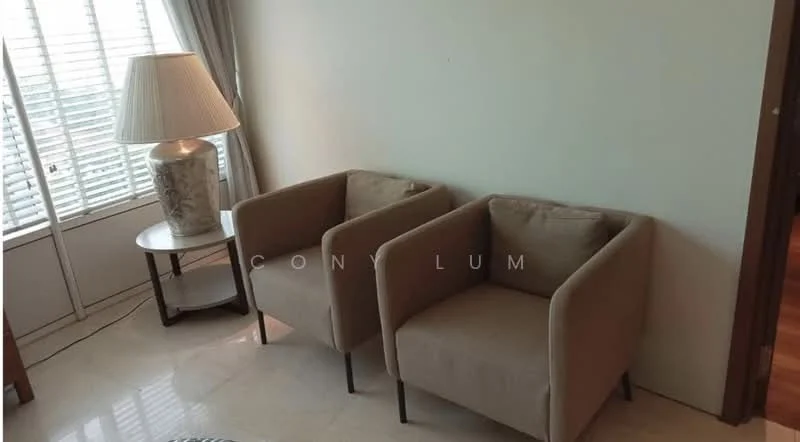 Living features: two beige armchairs, round side table, table lamp with decorative base, floor-to-ceiling windows, sheer curtains, marble flooring, neutral wall color; style: modern.