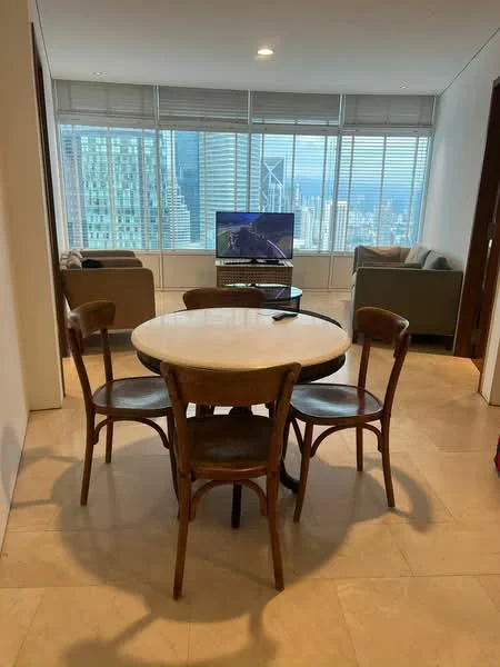 Dining features: round marble dining table, 4 wooden dining chairs, floor-to-ceiling windows, city skyline view, light-colored tiled flooring, recessed downlights, wall-mounted TV, sofa in background; style: modern; view: city.