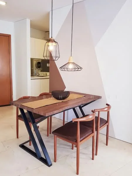 Dining features: wooden dining table with black metal legs, two wooden dining chairs with brown upholstery, pendant lights with wire frames, light-colored walls with geometric pattern, cream tiled flooring, open kitchen visible in background, kitchen cabinetry, kitchen appliances; style: modern.