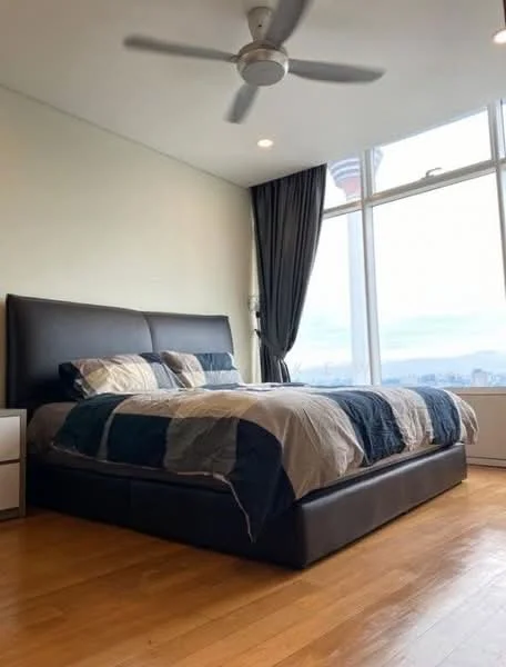 Bedroom features: king-size bed with upholstered headboard, bedding with geometric pattern, 2 bedside tables, floor-to-ceiling windows, curtains, wooden flooring, 5-blade ceiling fan, city view; style: modern; view: city.