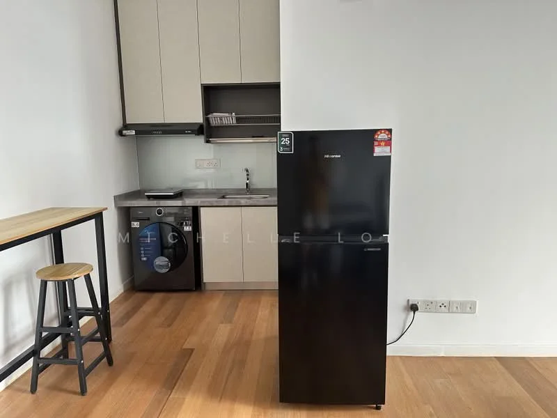 Kitchen features: black fridge, built-in cabinetry in light wood, countertop in grey, single-bowl stainless-steel sink, chrome pull-down faucet, built-in oven, washing machine, wooden bar table, stool, wooden flooring, white walls; style: modern.