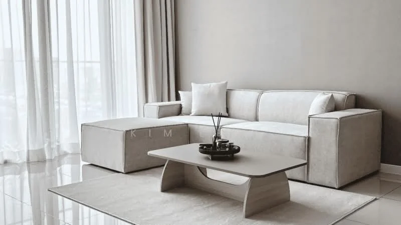 Living features: L-shape sectional sofa in light grey fabric, coffee table with curved design in light wood, area rug in neutral color, floor-to-ceiling windows with sheer curtains, polished tile flooring, decorative vase with sticks, throw pillows in white, minimalist decor; style: modern; view: city.