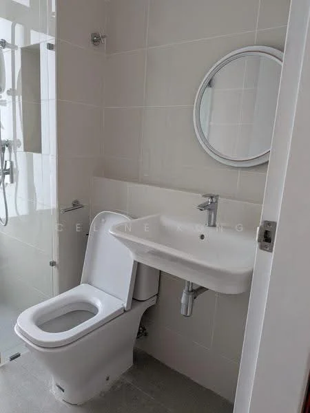 Bathroom features: white ceramic toilet, single-sink vanity with wall-mounted faucet, round frameless mirror, chrome basin mixer, white tiled walls, grey tiled flooring, glass shower enclosure, shower head with adjustable height; style: modern.