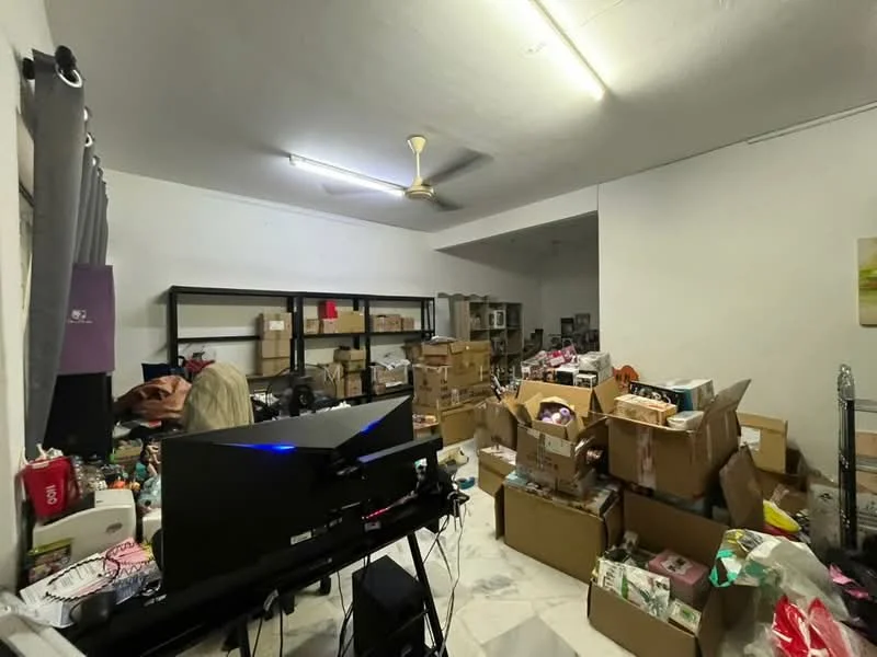 Room features: white painted walls, marble tile flooring, ceiling fan, shelves, cardboard boxes, various items scattered, desk with computer monitor, lighting fixtures.