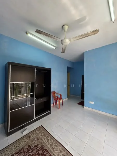 Living features: blue painted walls, white tiled flooring, 5-blade ceiling fan, recessed fluorescent lighting, built-in black cabinet with glass doors, red plastic chair, area rug with floral pattern, doorway leading to another room.
