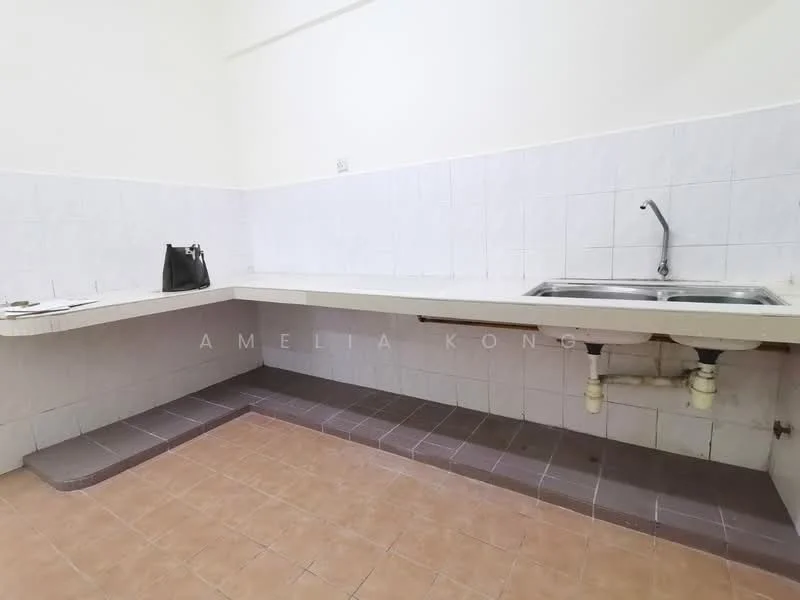 Kitchen features: L-shaped countertop, stainless-steel sink, chrome faucet, white tiled walls, light brown tiled flooring, under-counter plumbing, no visible appliances, minimal cabinetry.