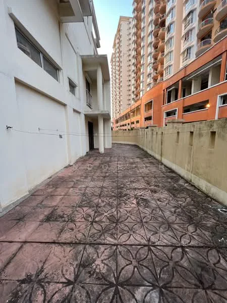 Exterior features: paved walkway, textured concrete flooring, surrounding walls, adjacent high-rise buildings, outdoor space, fenced area.