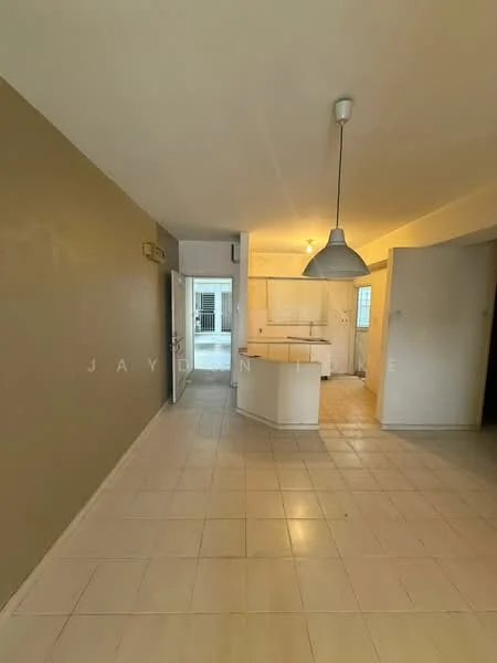 Room features: cream painted walls, light beige accent wall, tile flooring, pendant light fixture, open kitchen layout, visible kitchen counter, doorway leading to another room, natural light from windows; style: modern.