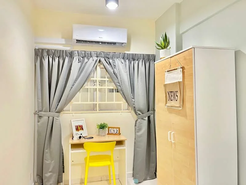 Study features: grey curtains, white walls, 1 wall-mounted split AC, wooden desk, yellow chair, framed artwork, decorative plant, built-in wardrobe, light fixture on ceiling; style: modern.