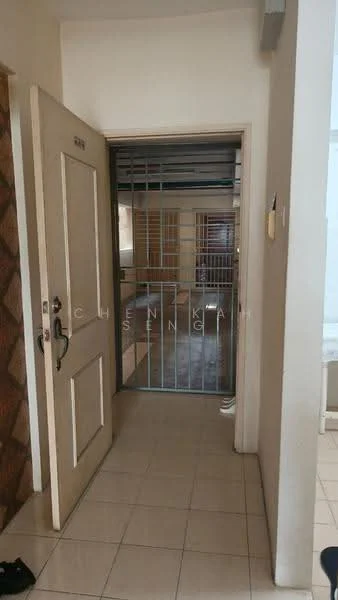 Room features: white painted walls, cream tiled flooring, wooden door, security grille door, door frame, light switch, door handle, visible hallway, interior door, light source.