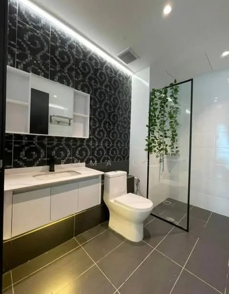 Bathroom features: black patterned wall tiles, white wall tiles, grey floor tiles, single-sink vanity with white cabinet, black faucet, framed mirror above vanity, walk-in shower with glass enclosure, toilet, greenery decor, recessed lighting, LED strip lighting, open shelving above vanity; style: modern.
