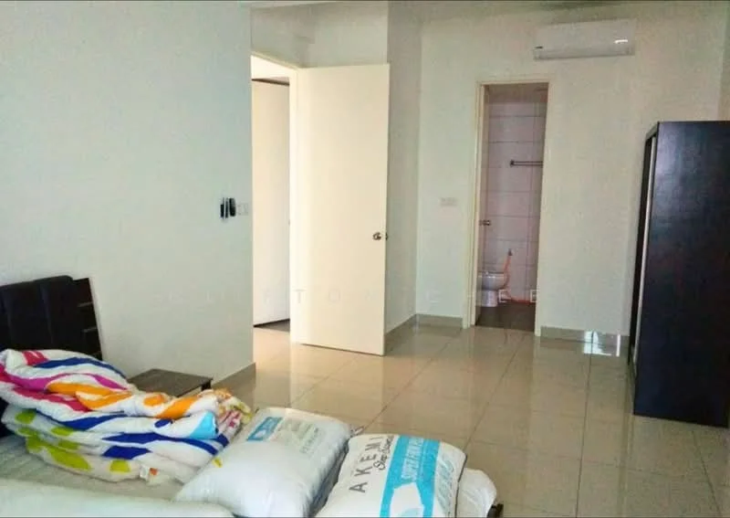 Bedroom features: cream painted walls, glossy tile flooring, 1 wall-mounted split AC, double-door wardrobe, bed with colorful bedding, white door, doorway leading to bathroom, natural light from doorway. Bathroom features: toilet visible, white tiled walls, white tiled flooring.