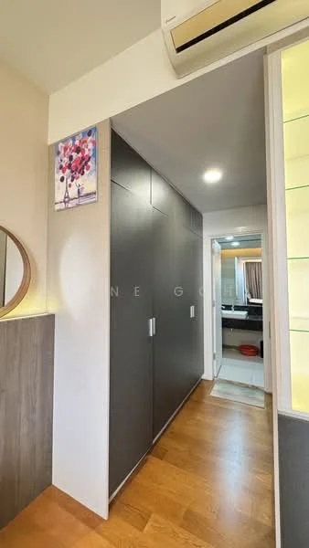 Room features: wooden flooring, dark cabinetry, mirror wall, recessed lighting, air conditioning unit, framed artwork, light-colored walls, doorway leading to another room; style: modern.
