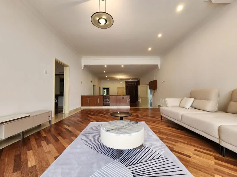 Living features: light wood flooring, white painted walls, tray ceiling, recessed downlights, large beige sectional sofa, round coffee table with marble top, decorative area rug with geometric pattern, open layout to kitchen, floor-to-ceiling windows, wall-mounted TV console; style: modern.