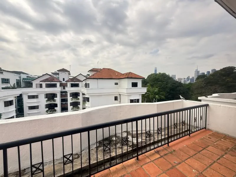 Room features: terracotta tile flooring, white painted walls, black metal railing, view of city skyline, roof with red tiles, surrounded by greenery; style: modern; view: city.
