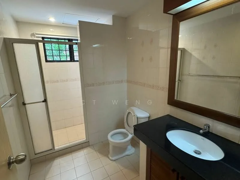 Bathroom features: white tiled walls, cream tiled flooring, single-sink vanity with black countertop, round basin, chrome basin mixer faucet, one-piece toilet, glass shower enclosure, shower head, mirror above vanity, window for natural light; style: modern.