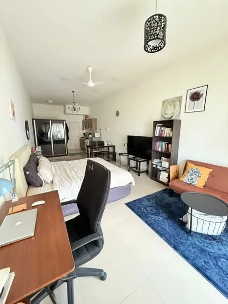 Living features: queen-size bed with white bedding, 3-seater fabric sofa in orange, coffee table with white base, area rug with geometric pattern in blue, wall-mounted TV, black bookshelf with books, decorative cushions, ceiling fan, recessed downlights, white painted walls, tile flooring, desk with laptop and lamp, dining table with chairs, stainless-steel fridge; style: modern.
