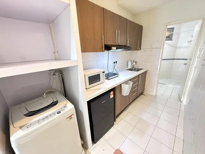 Kitchen features: brown wooden cabinetry, white tiled backsplash, white ceramic tile flooring, stainless-steel sink, chrome pull-down faucet, built-in microwave, black refrigerator, washing machine, countertop space, under-cabinet lighting; style: modern. Laundry features: washing machine, shelf above washing machine.