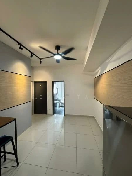 Room features: white painted walls, grey accent wall, polished ceramic tile flooring, 5-blade ceiling fan with light, track lighting, door to hallway, door to another room, kitchen cabinetry, stainless-steel fridge, open space layout; style: modern.