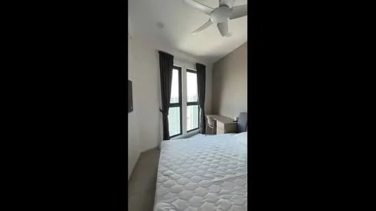 Bedroom features: queen-size bed with mattress, 5-blade ceiling fan, floor-to-ceiling windows, grey accent wall, white painted walls, dark curtains, wooden desk, chair, carpeted flooring; style: modern; view: city.