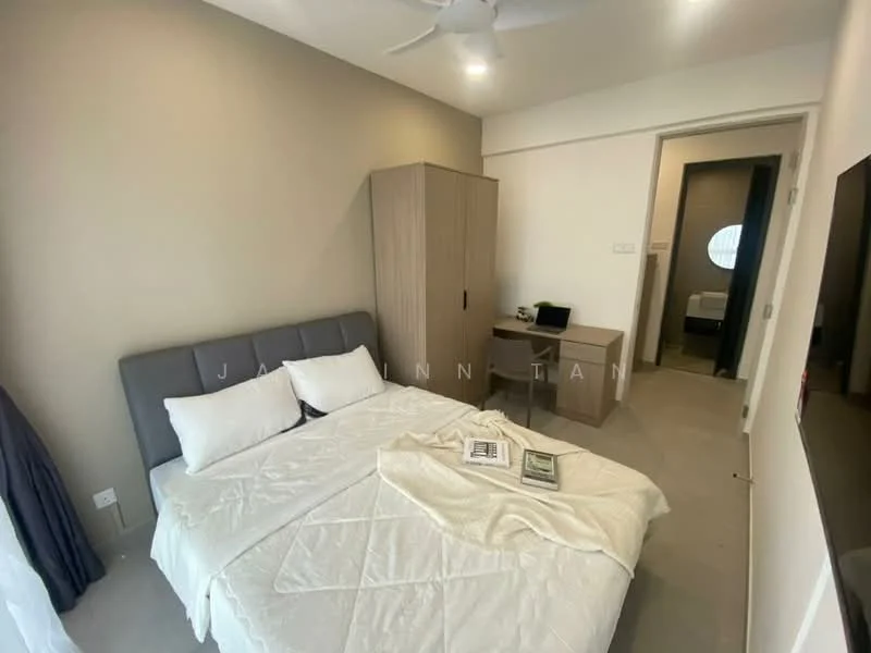 Bedroom features: queen-size bed, upholstered headboard, white bedding, two bedside pillows, ceiling fan, built-in wardrobe, study desk, wall-mounted TV, neutral wall color, carpeted flooring, window with sheer curtains; style: modern. Room features: doorway leading to bathroom, light-colored walls, minimalist decor.