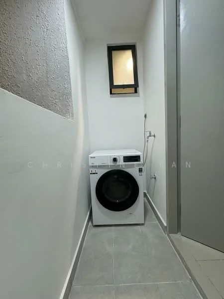 Laundry features: front-load washing machine in white, grey tiled flooring, white painted walls, small window, door leading to another room.