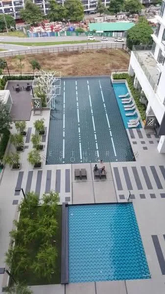 Exterior type: swimming pool deck; features: infinity pool, lap pool, pool deck with loungers, landscaped garden with plants, stone-paved walkway, seating area with chairs and tables, surrounding greenery, view of nearby buildings, fenced perimeter; style: modern.