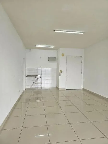 Room features: white painted walls, glossy ceramic tile flooring, fluorescent ceiling lights, single door, wall-mounted air conditioning unit, kitchenette area with sink, neutral color scheme; style: modern.