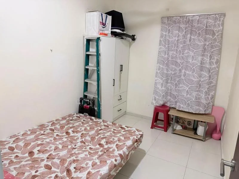 Bedroom features: white painted walls, tile flooring, queen-size bed with floral patterned bedding, built-in wardrobe with white finish, curtains with leaf pattern, small wooden table, plastic stool, shelves on wall.