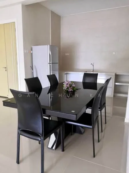 Dining features: black dining table, 6 black dining chairs, white cabinetry, stainless-steel fridge, kitchen sink, grey wall, glossy floor tiles, decorative vase with flowers; style: modern.