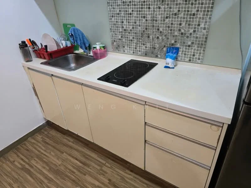 Kitchen features: single-bowl stainless-steel sink, chrome faucet, white countertop, ceramic tile backsplash with mosaic pattern, built-in induction cooktop, cream cabinetry with flat-panel doors, wood laminate flooring, dish drying rack, kitchen utensils, cleaning supplies; style: modern.