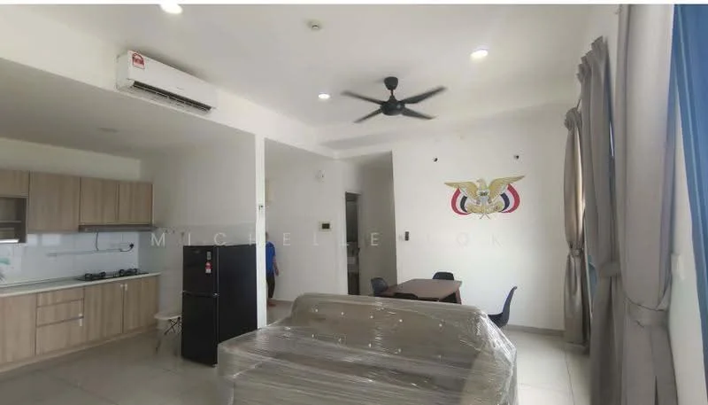 Living features: 5-blade ceiling fan, wall-mounted split AC, grey sofa with plastic wrap, black fridge, kitchenette with wooden cabinetry, white tiled backsplash, stainless-steel sink, 2-burner gas hob, dining table with 4 chairs, large window with curtains, light-colored tiled flooring, decorative wall art; style: modern.