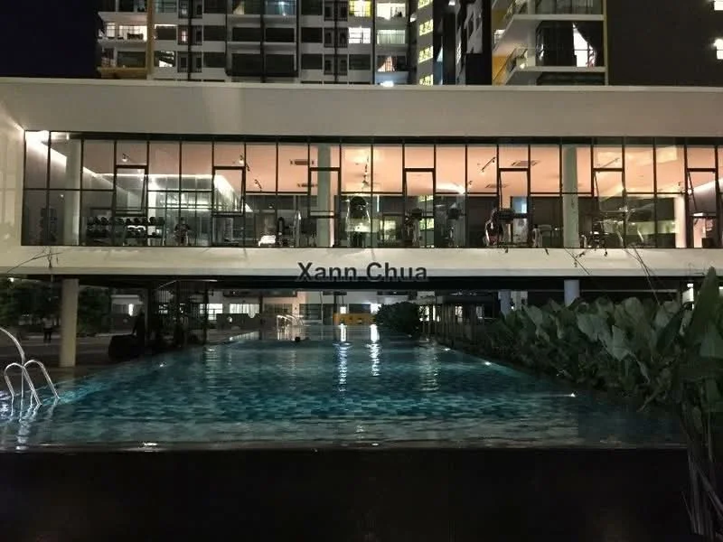 Exterior type: high-rise condominium; features: glass curtain wall, swimming pool, pool deck with loungers, outdoor gym, landscaped garden, illuminated building facade, manicured lawn, surrounded by mature greenery; style: modern.