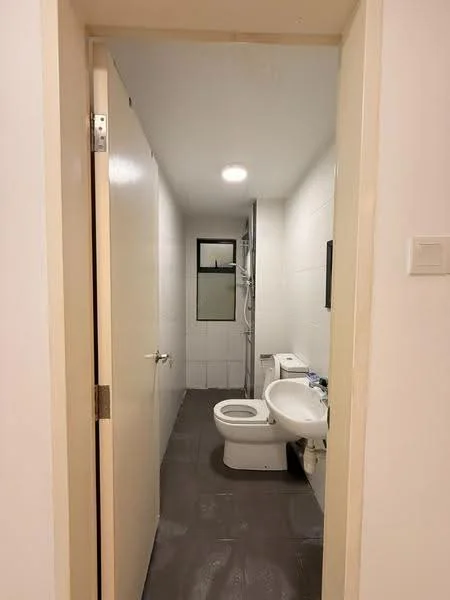 Bathroom features: white tiled walls, grey ceramic tile flooring, one-piece toilet, single-sink vanity with white cabinet, mirror above sink, shower with glass enclosure, recessed ceiling light, window for natural light; style: modern.