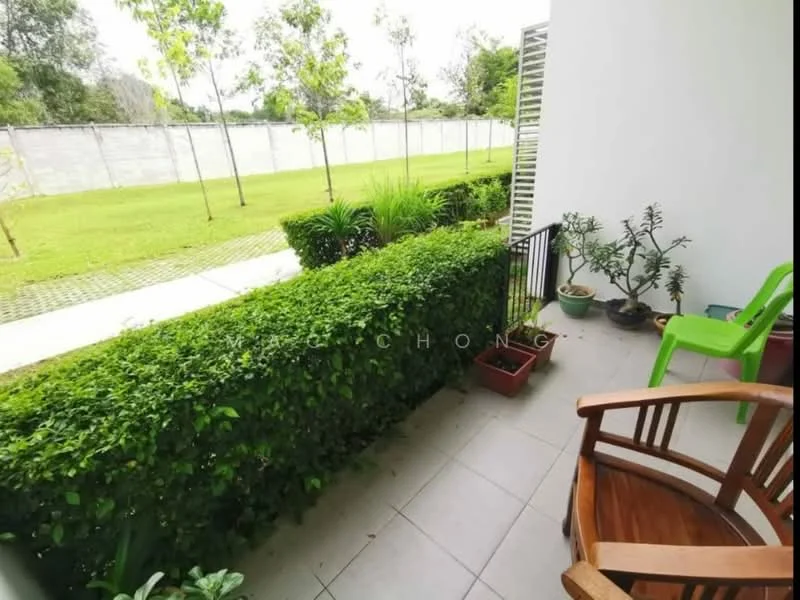 Room features: paved flooring, green hedge, potted plants, wooden chair, green plastic chair, grass lawn, fence in background; view: garden.