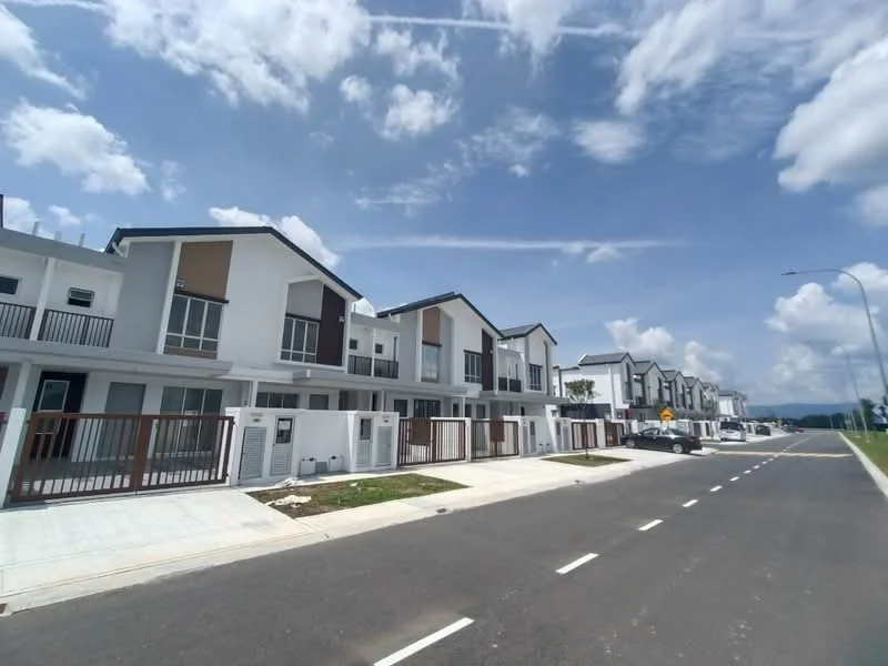 Exterior type: linked terrace house; features: white painted facade, brown accent panels, flat roof, two-storey, manicured lawn, paved walkway, street view, multiple car porches, surrounded by greenery, clear blue sky; style: modern.