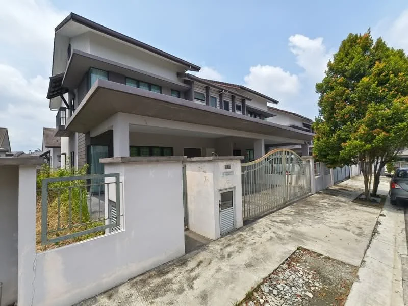 Exterior type: detached bungalow; features: white painted facade, flat roof, two-storey structure, gated entrance, manicured landscaping, driveway with interlocking pavers, large windows, balconies on upper floor, surrounded by greenery; style: modern.