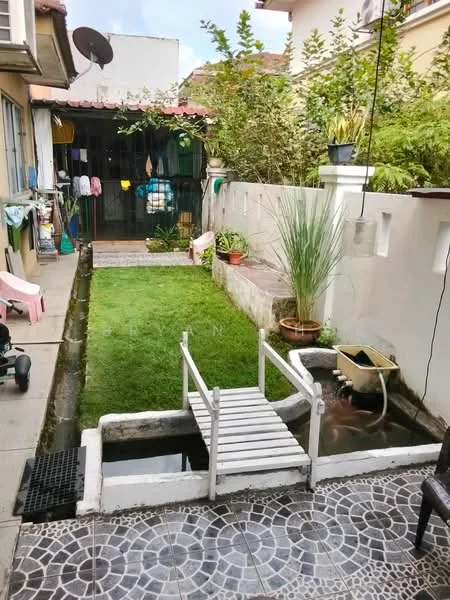 Exterior features: manicured lawn, garden area with plants, paved walkway, water feature with small pond, wooden bridge over pond, clothes drying area with clothesline, decorative pots with plants, fenced garden area.