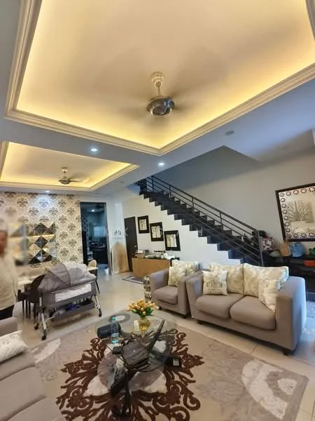 Living features: sofa set in light grey fabric, decorative cushions in cream and gold, coffee table with glass top, area rug with floral pattern, 5-blade ceiling fan with integrated LED light, recessed lighting in tray ceiling, wall-mounted artwork, staircase with metal railing, decorative wall with patterned wallpaper, potted plants, side table with decorative items; style: modern.