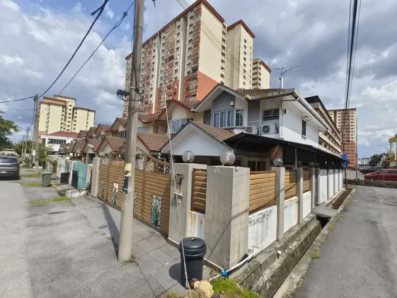 Exterior type: linked terrace house; features: wooden fence, concrete wall, gabled roof, multiple storeys, balconies, street view, surrounded by other residential buildings, paved walkway, utility poles, visible parking area; style: modern.