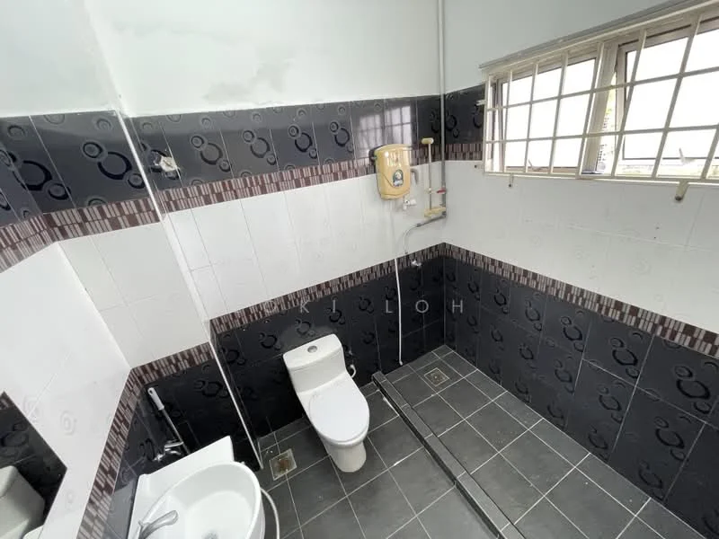 Bathroom features: white toilet, shower with wall-mounted water heater, grey ceramic tile flooring, black and white wall tiles, window with metal grille, sink with pedestal, decorative border tile, shower area with tiled wall; style: modern.